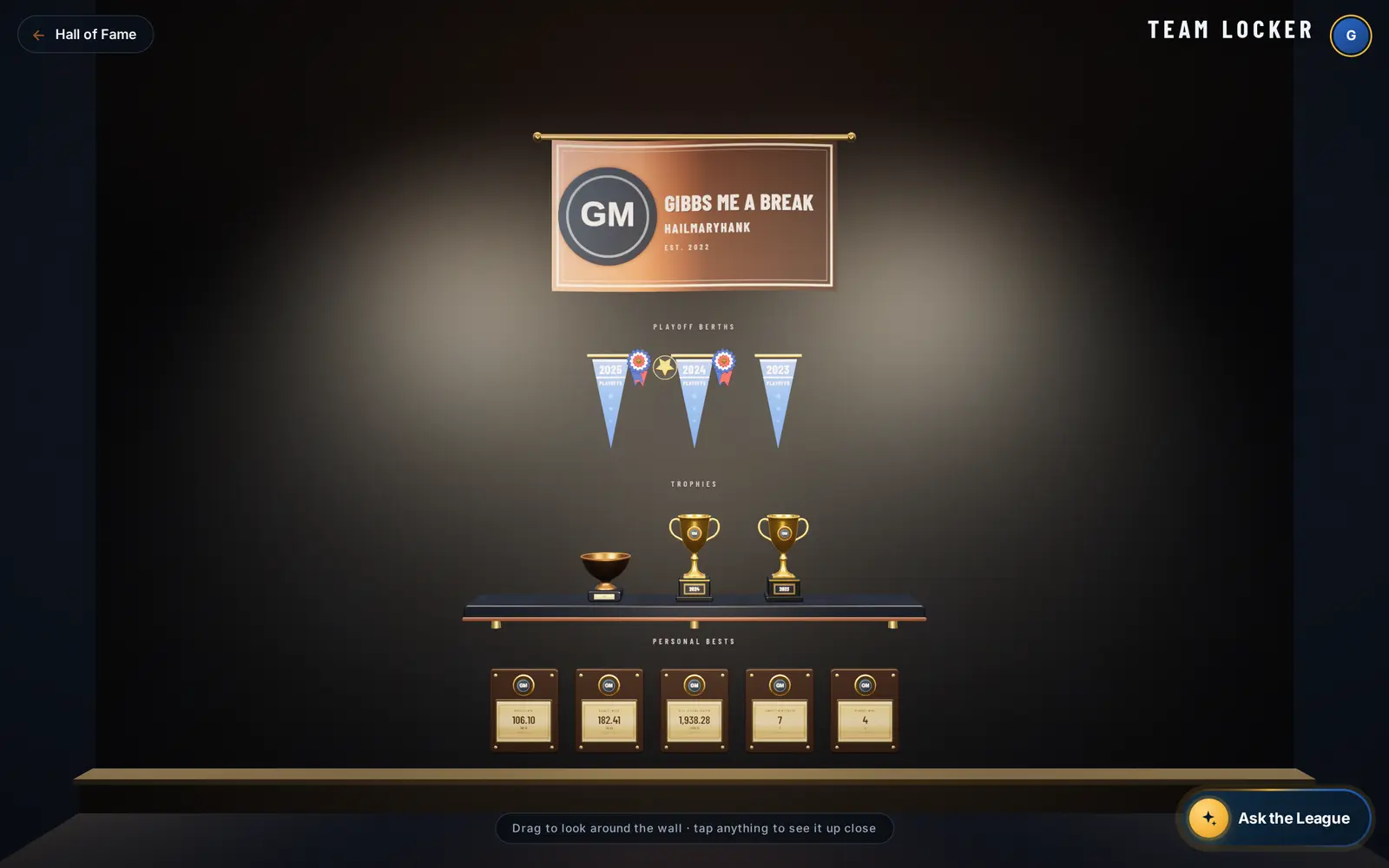 A manager's locker: banner, playoff pennants, trophies and personal bests